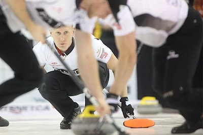 Skip Brad Jacobs watches immediately after throwing the rock during the final draw against Team McEwen on November 23, 2014.