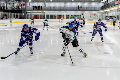 Materia Land races for a puck in ACHA action