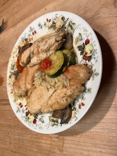 Creamy chicken with orzo, mushrooms tomatoes and zucchini 