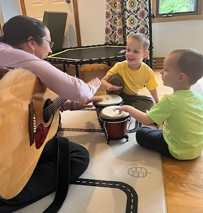 The use of the bongos to teach turn taking.